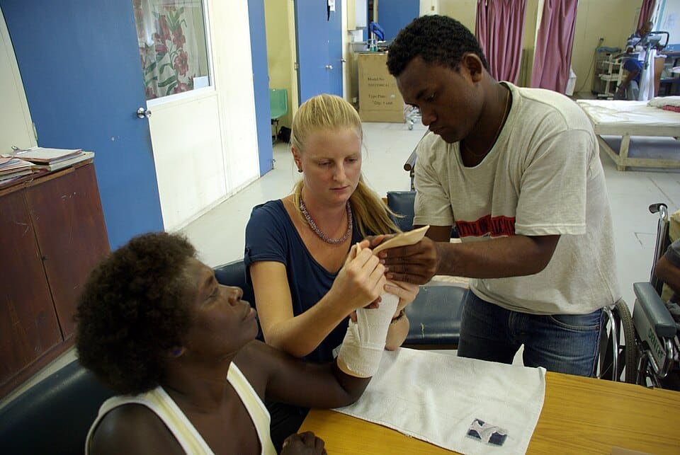 An occupational therapist working with a patient