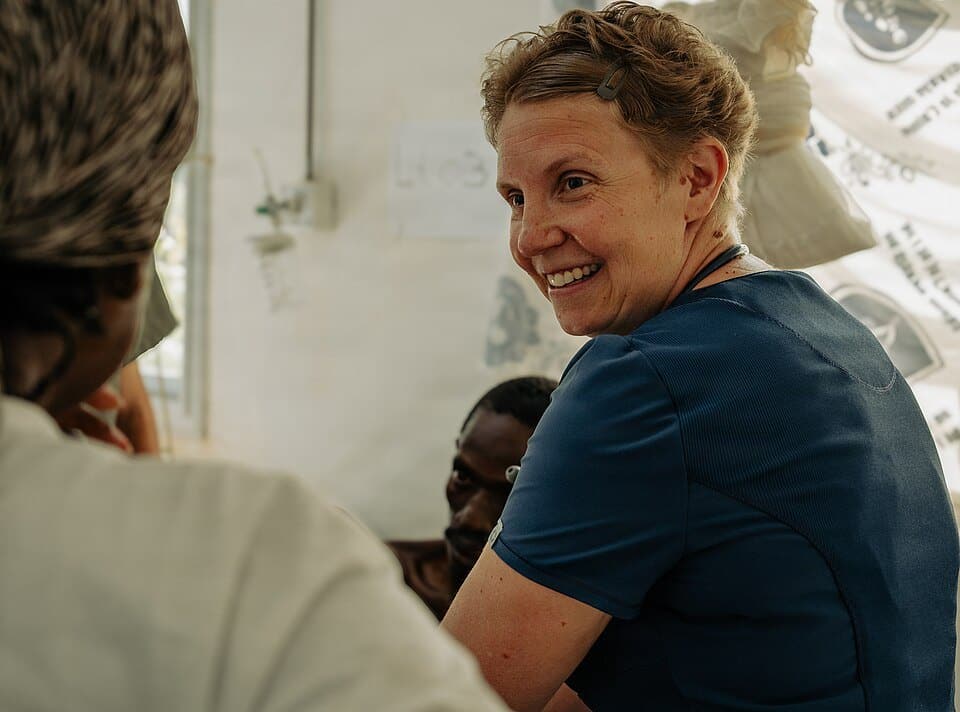A physical therapist working with a patient